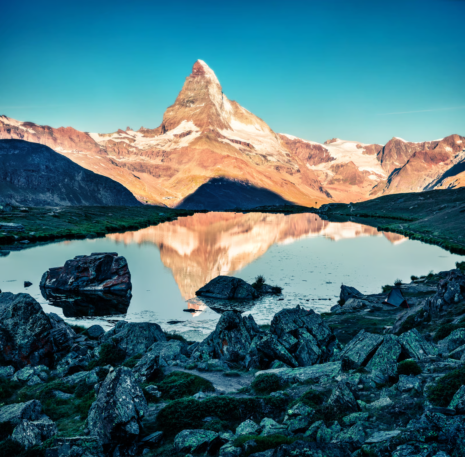 Matterhorn reflected in Stellisee at sunrise near Zermatt, Switzerland